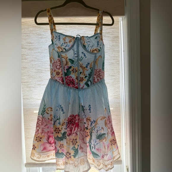 Agua Bendita, Resort Wear
Riveria Radiance Spring Blush Floral Cotton Minidress - Picture 5 of 11